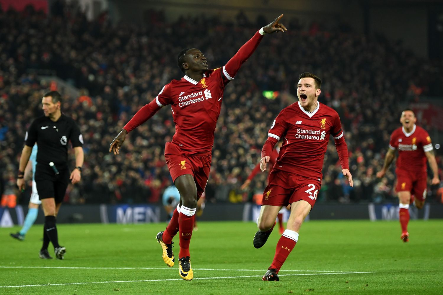 Sadio Mane and Andy Robertson celebrate against Manchester City in 2018