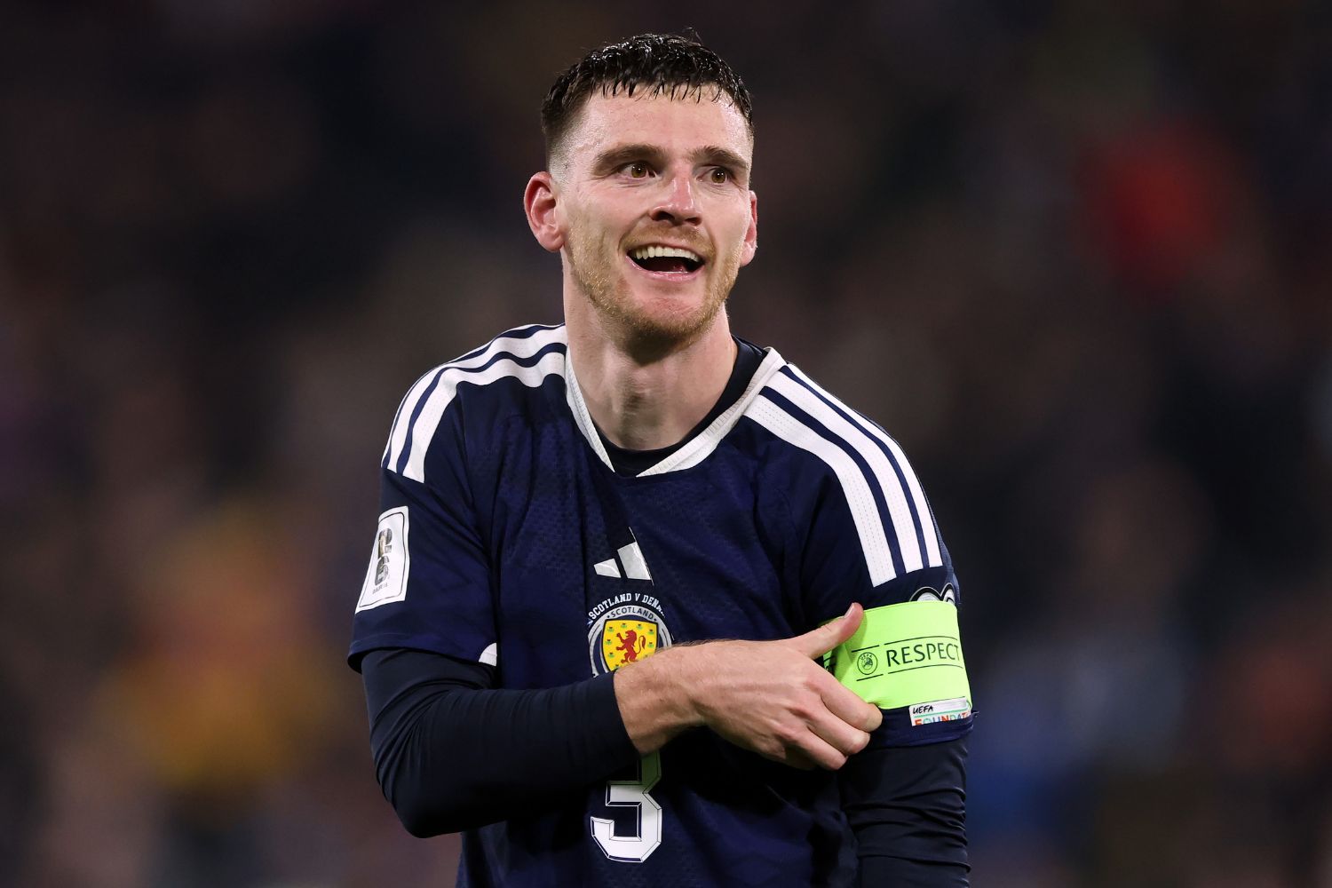 Andy Robertson celebrates qualifying for the World Cup