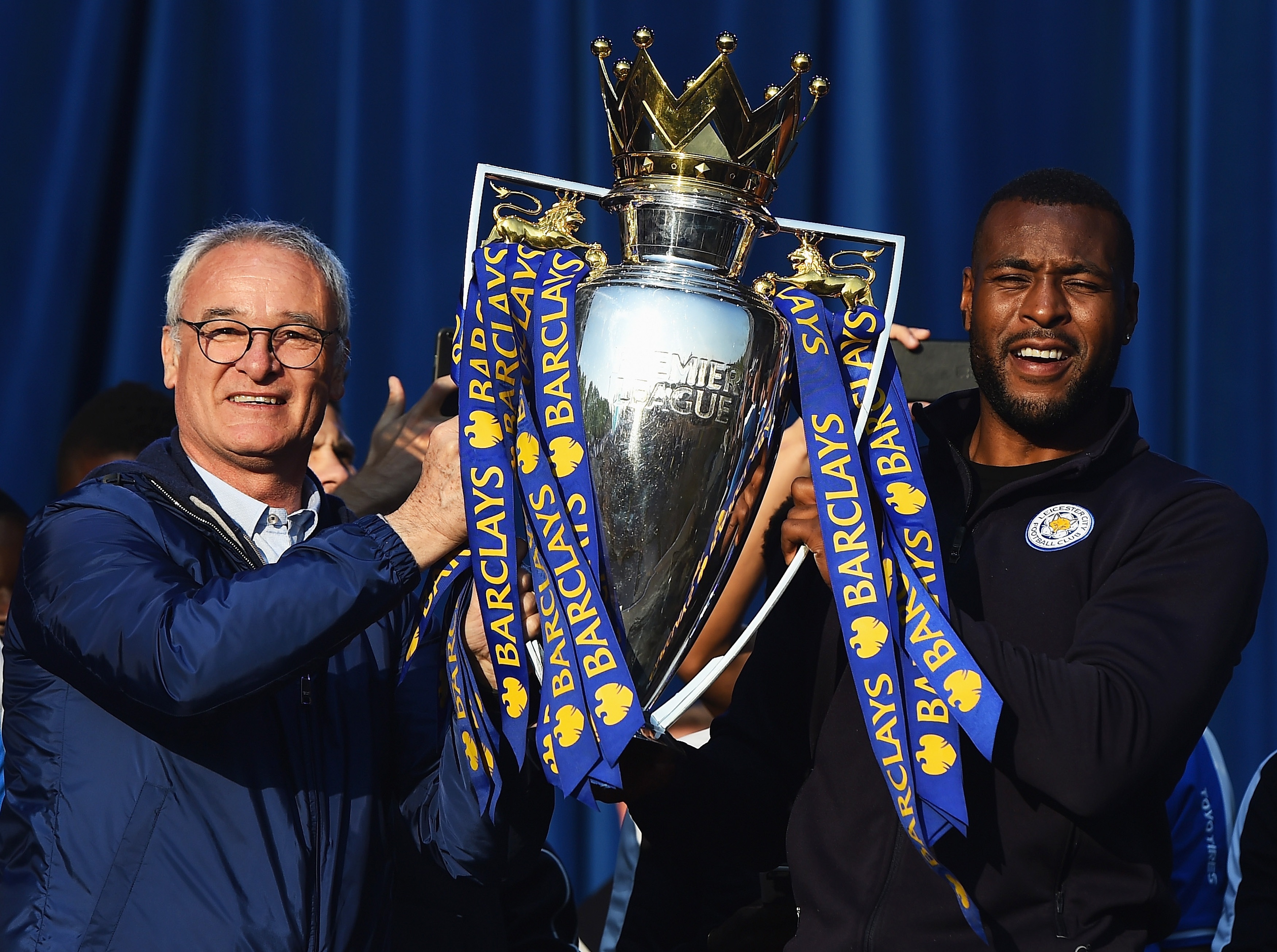 Claudio Ranieri lifts Premier League trophy with Wes Morgon.