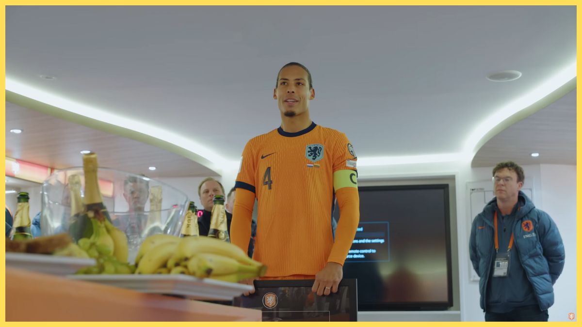 Virgil van Dijk speaks to teammates after breaking Dutch captain appearance record