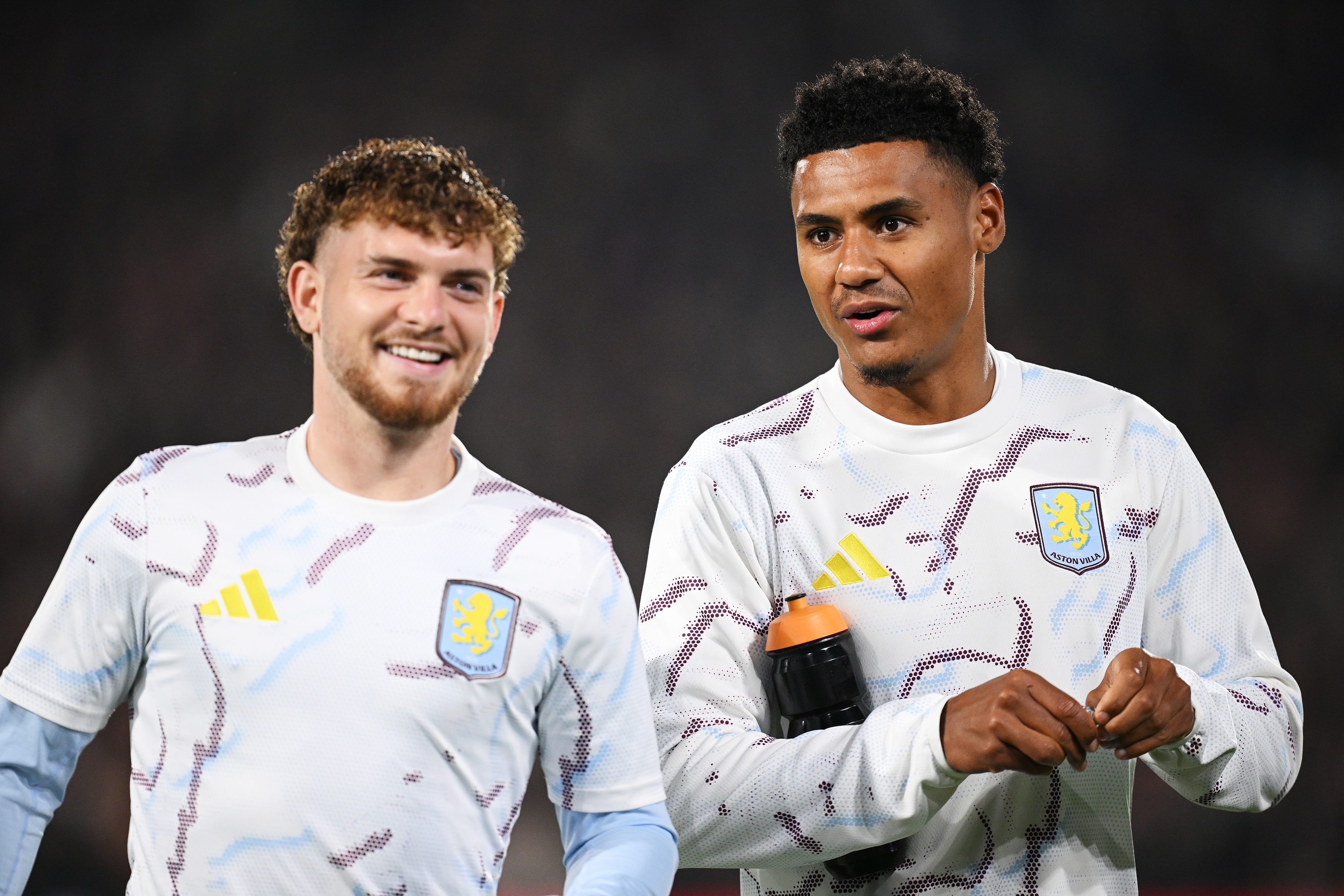 Harvey Elliott smiles standing next to Ollie Watkins.