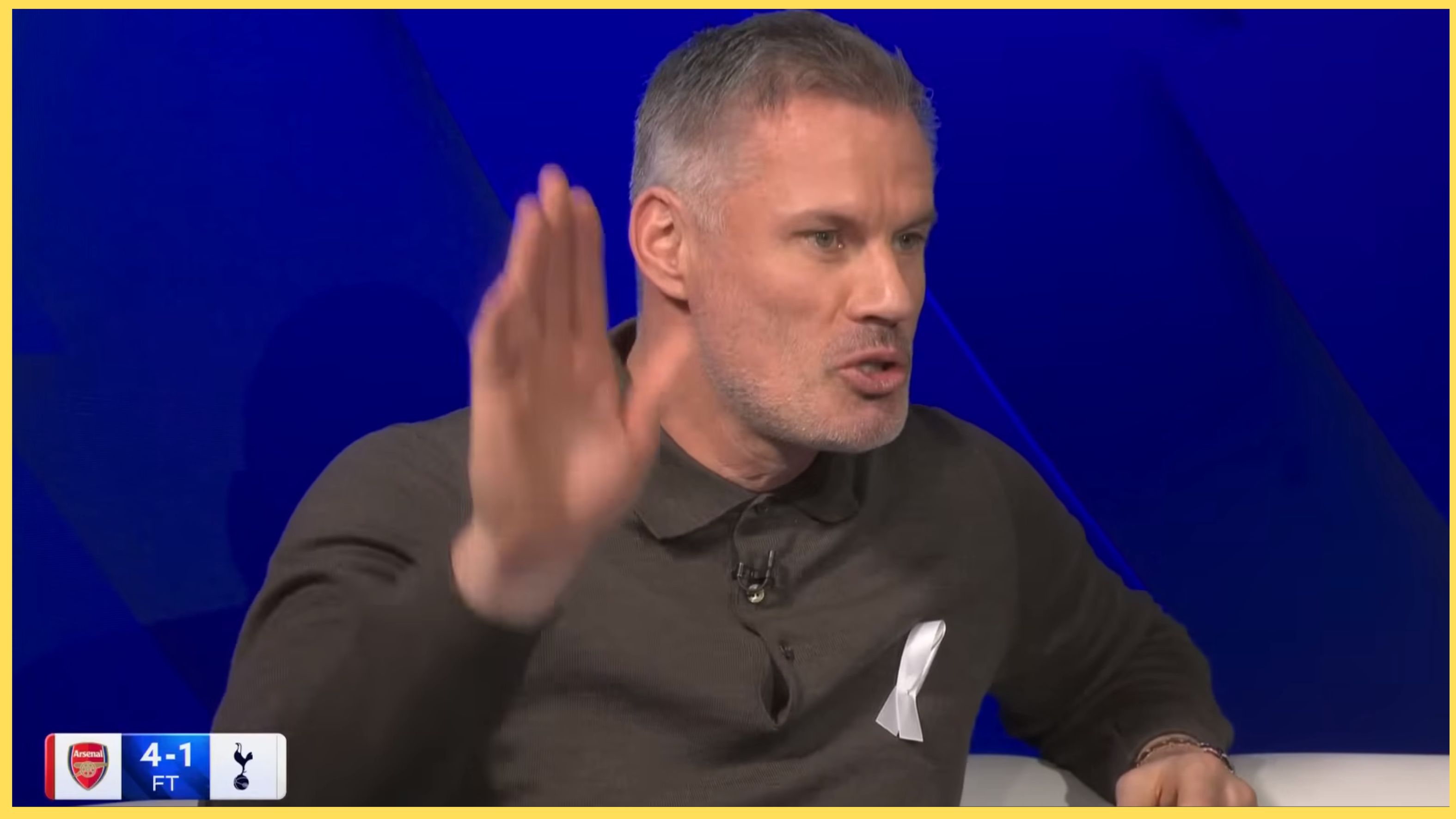 Jamie Carragher holds up his hand in the Sky Sports studio.