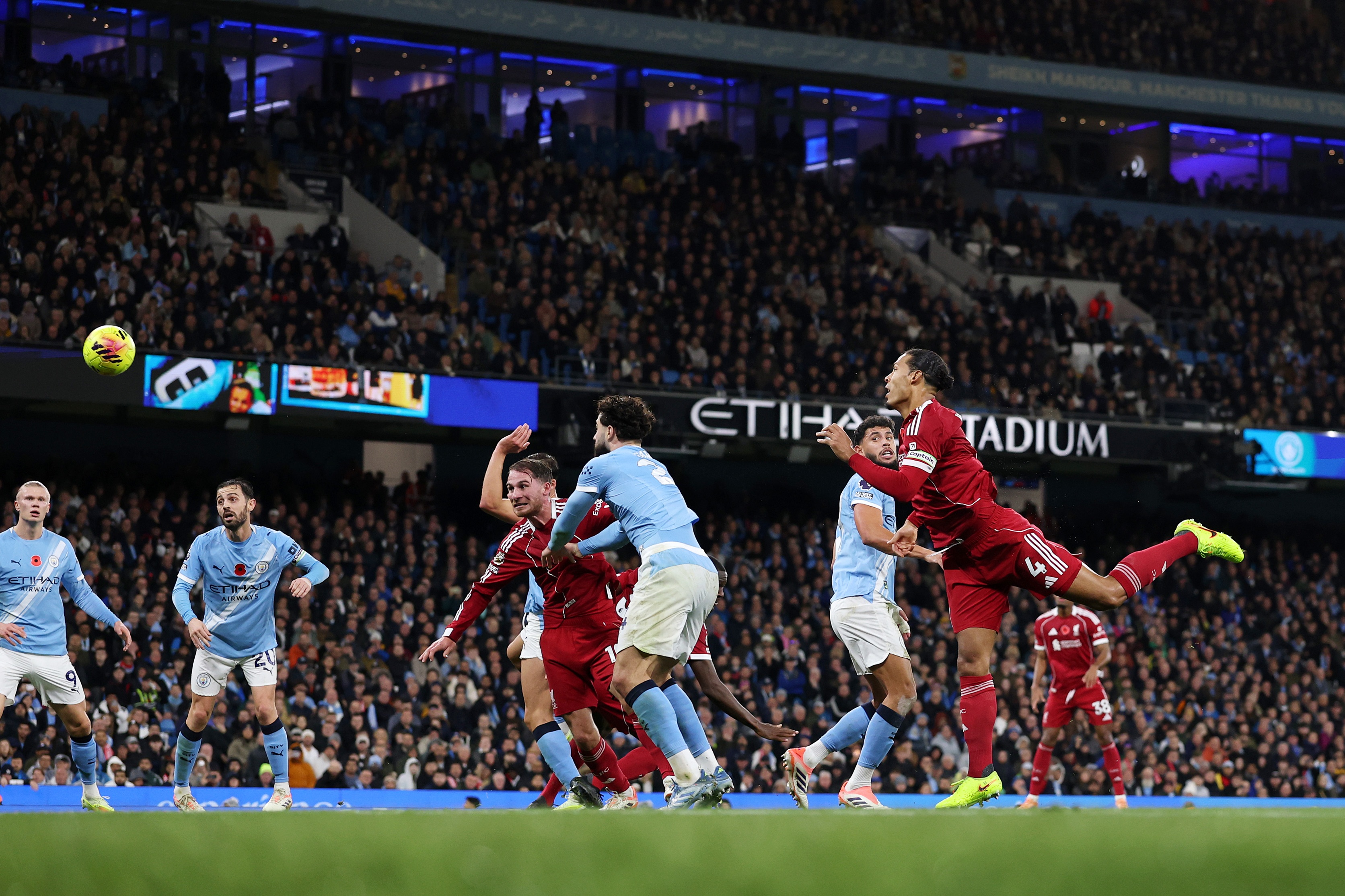 Virgil van Dijk heads the ball during Liverpool vs Man City.