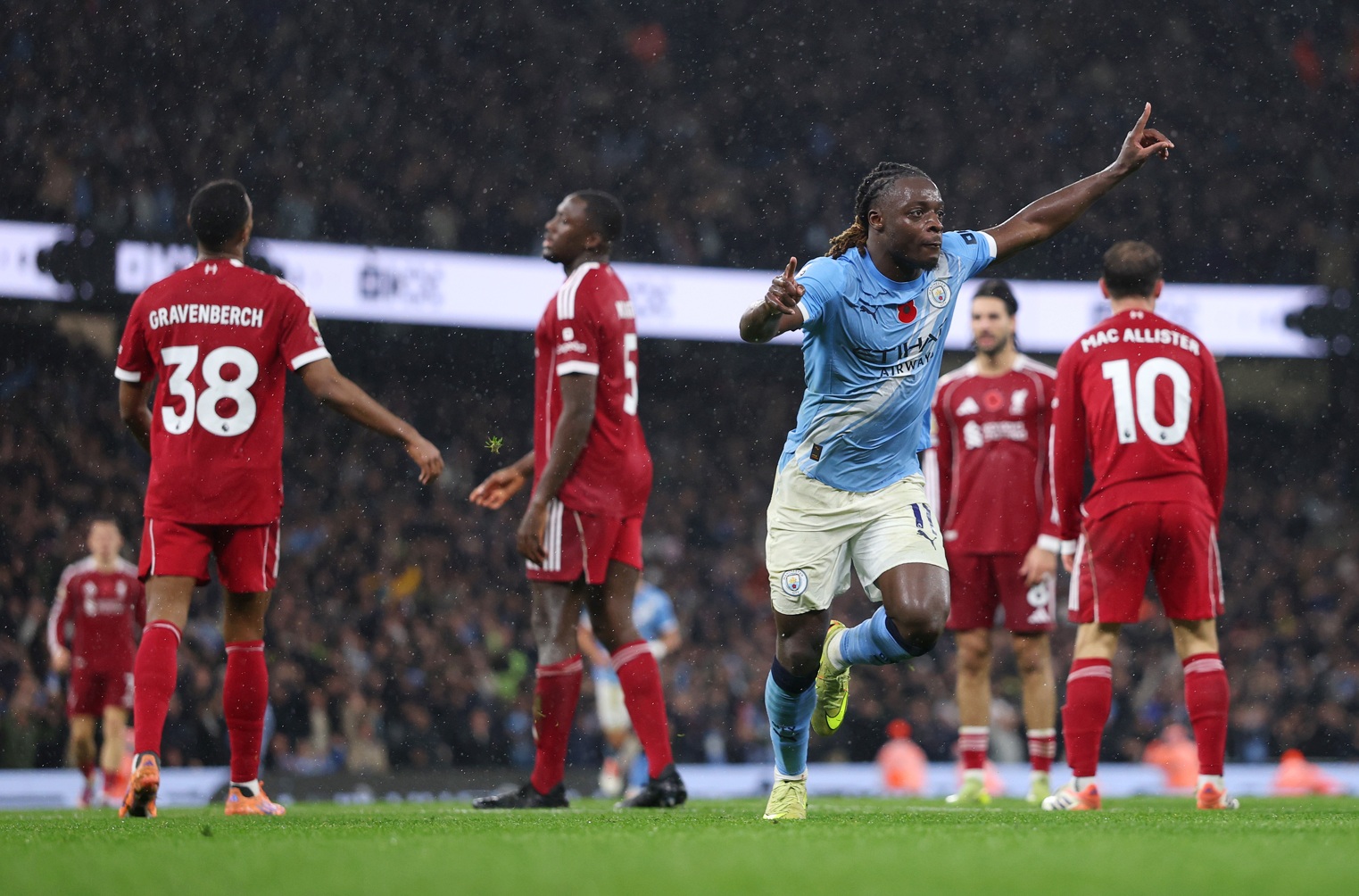 Jeremy Doku celebrates scoring against Liverpool on Sunday