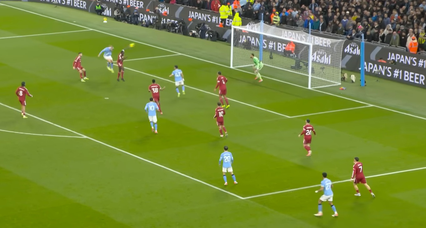 Erling Haaland gets above Ibrahima Konate to score for Manchester City