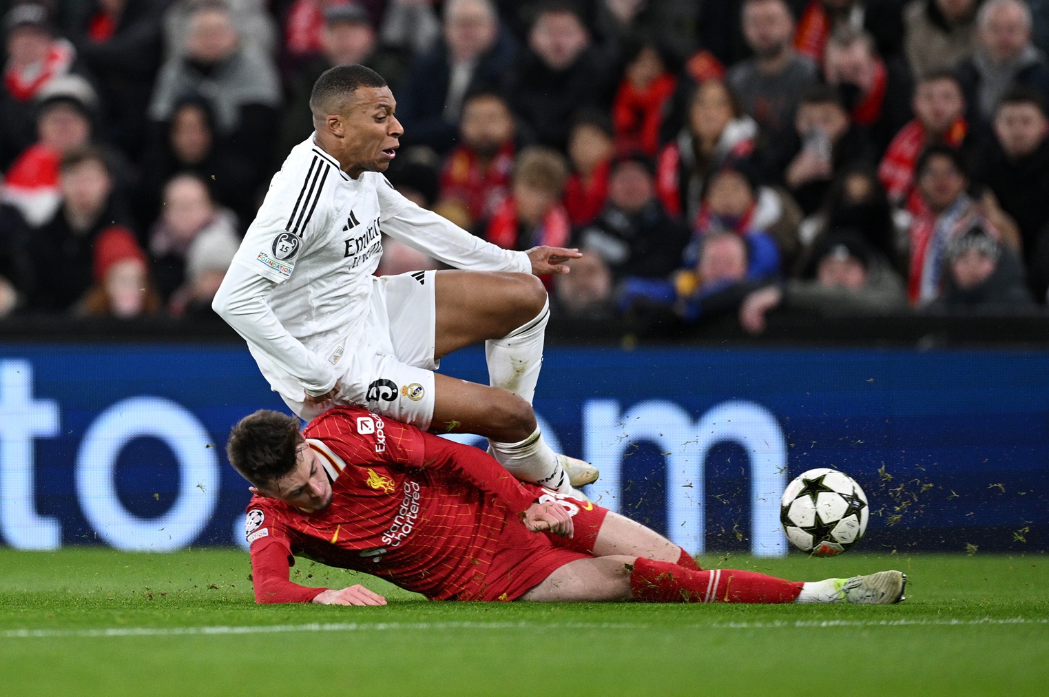 Conor Bradley sends Kylian Mbappe flying at Anfield last season