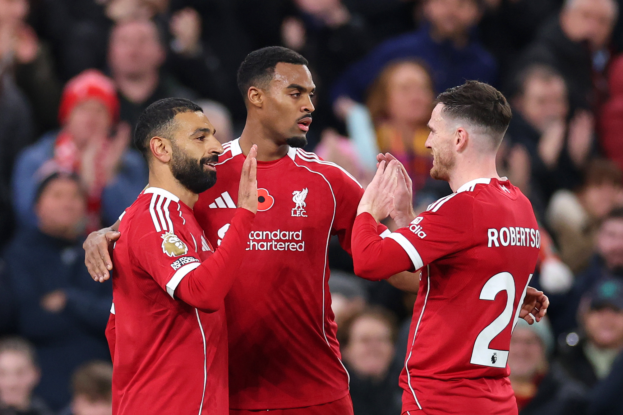 Mo Salah, Ryan Gravenberch and Andy Robertson celebrate during Liverpool's win over Aston Villa earlier this month