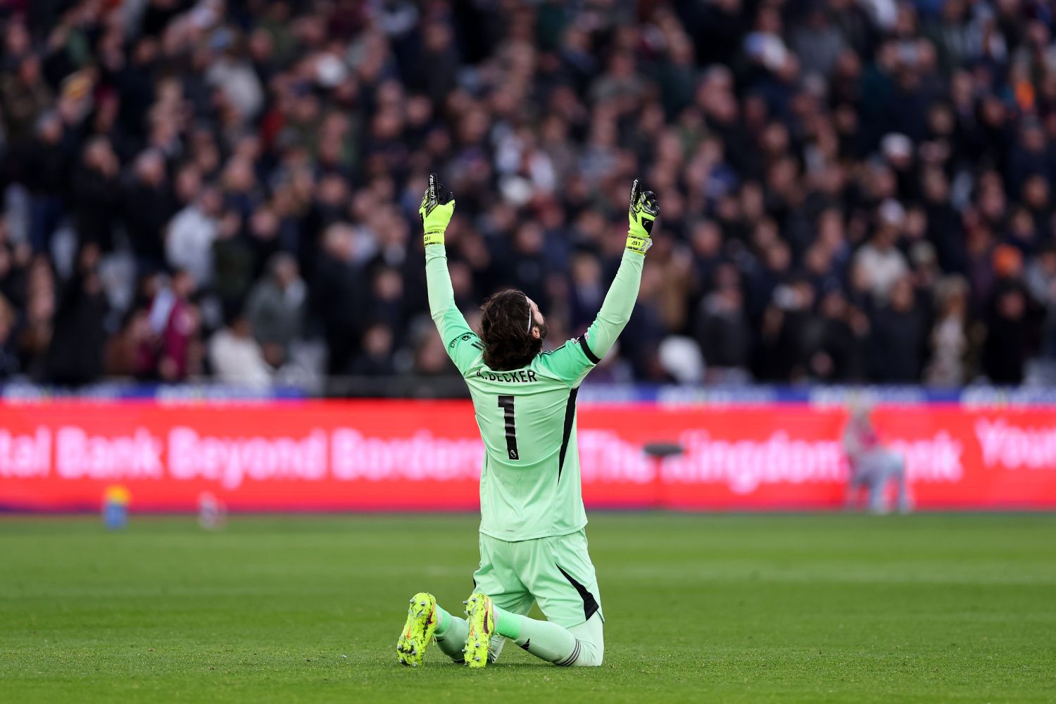 Alisson Becker celebrates against West Ham
