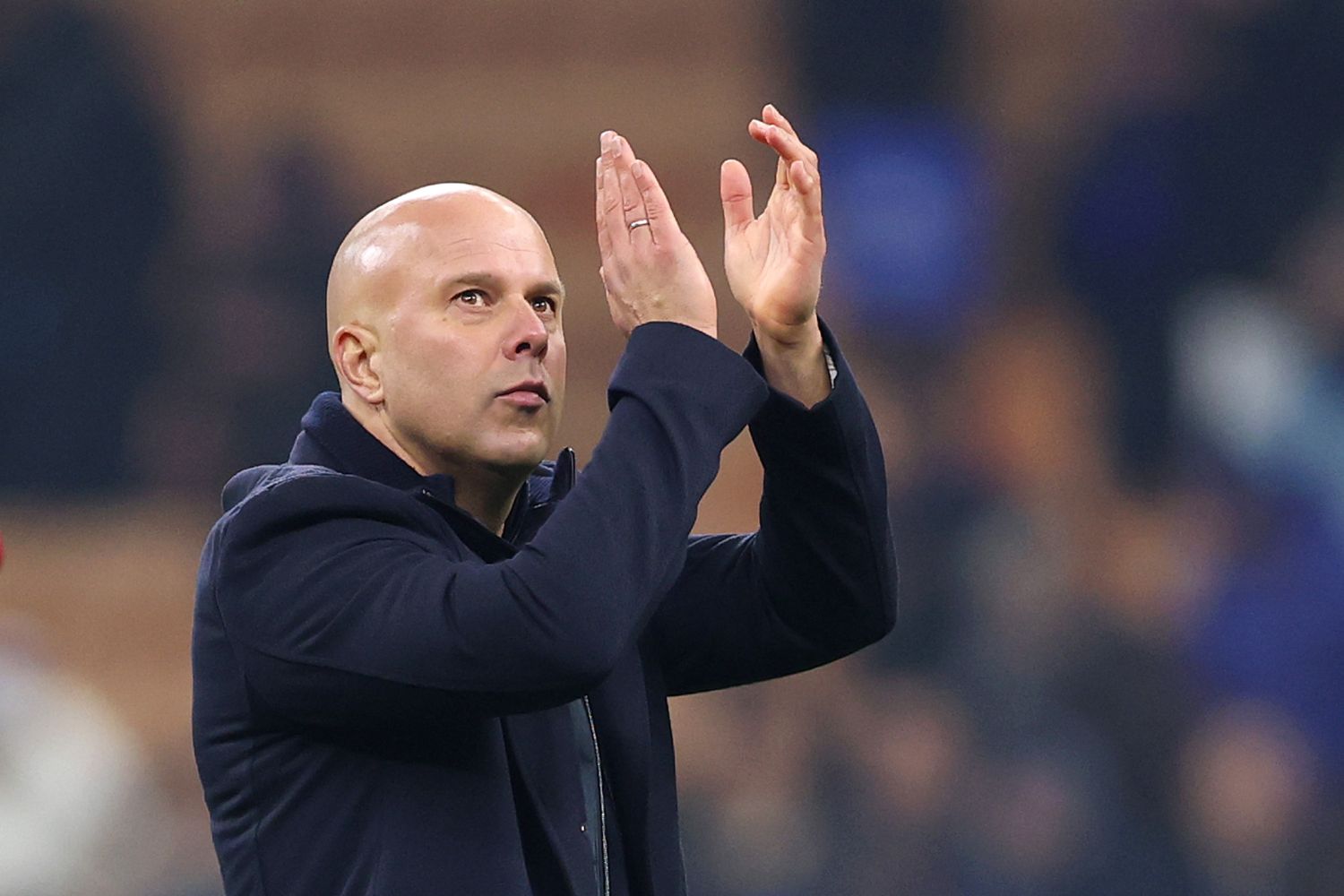 Arne Slot applauds Liverpool fans in Milan