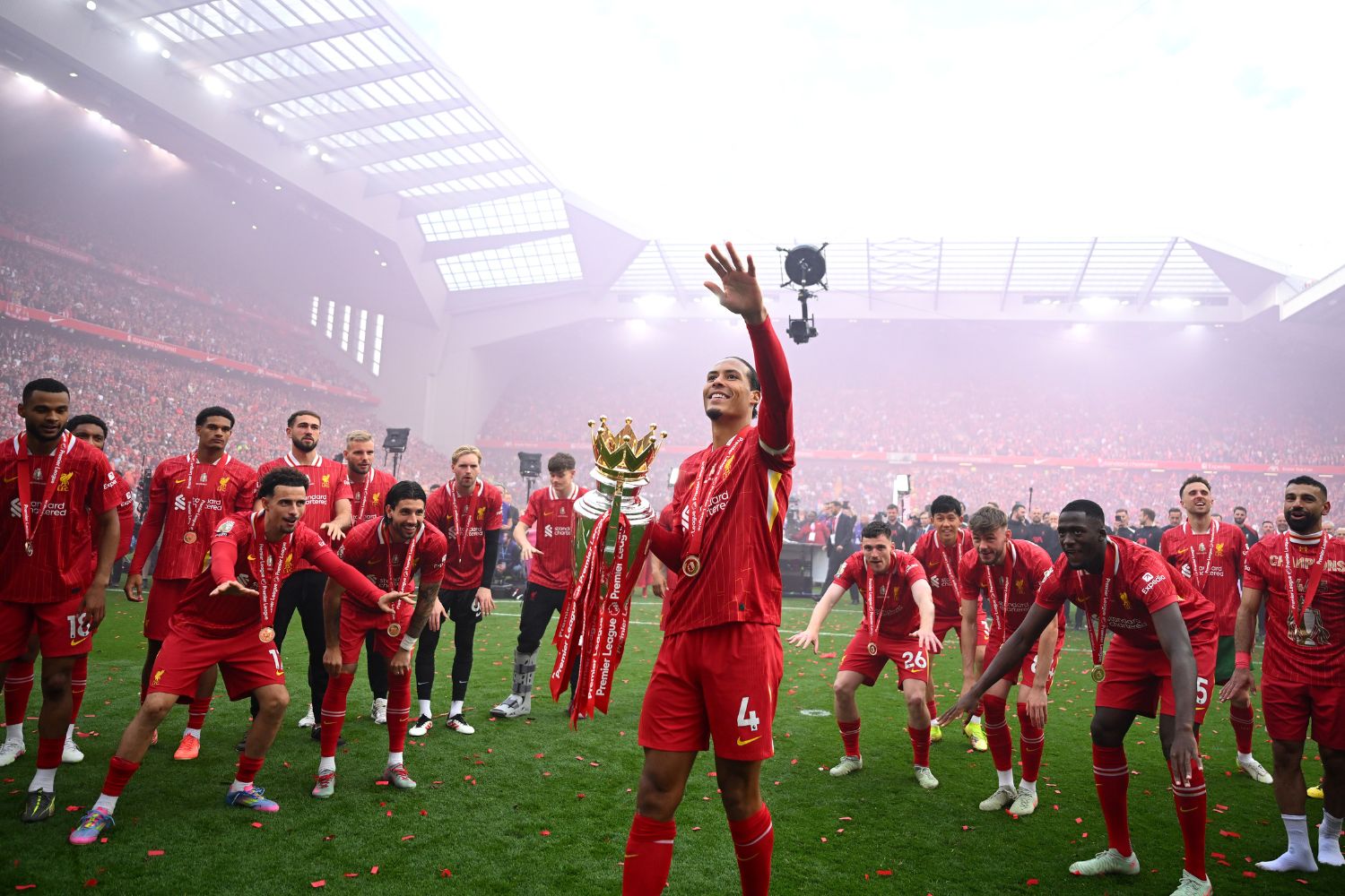 Virgil van Dijk with the Premier League trophy at Anfield