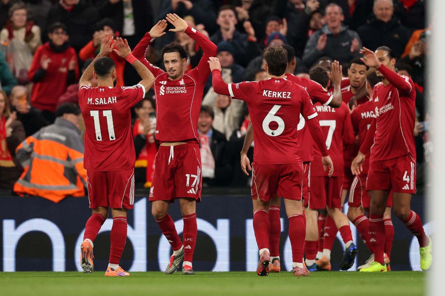 Mohamed Salah of Liverpool celebrates with teammate Curtis Jones after Hugo Ekitike scored