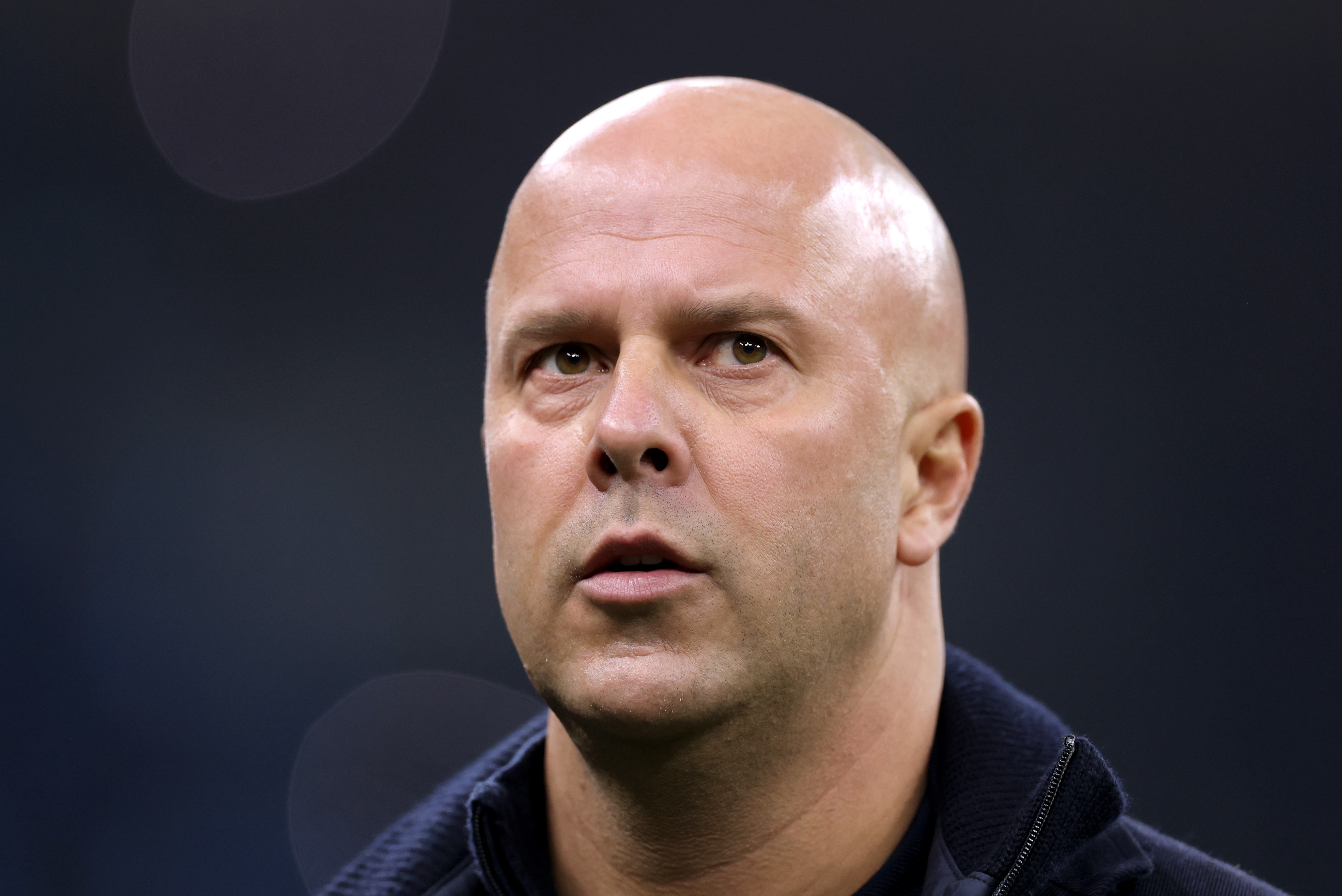Arne Slot looks on at the San Siro.