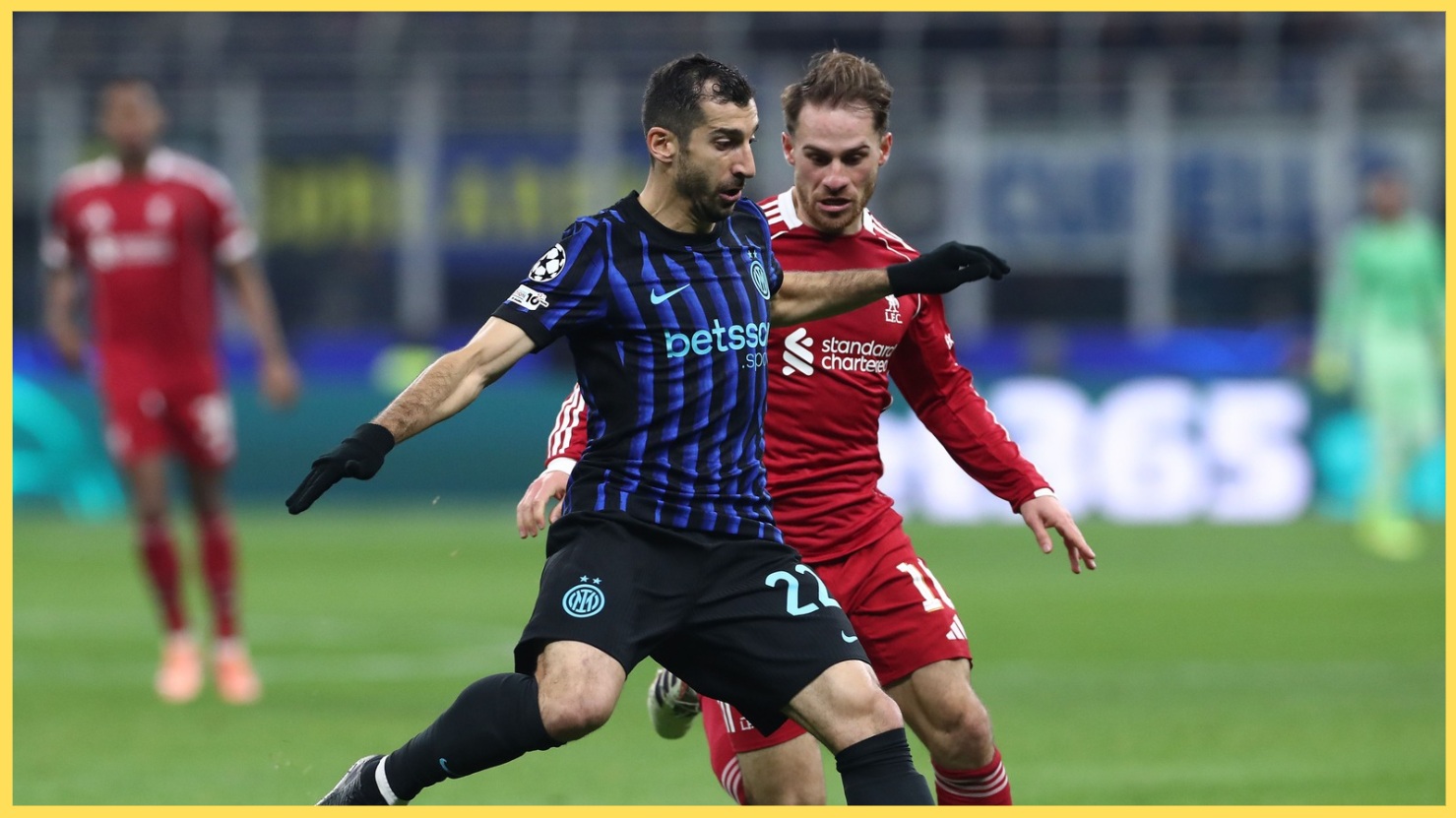 Alexis Mac Allister vies with Henrikh Mkhitaryan for possession