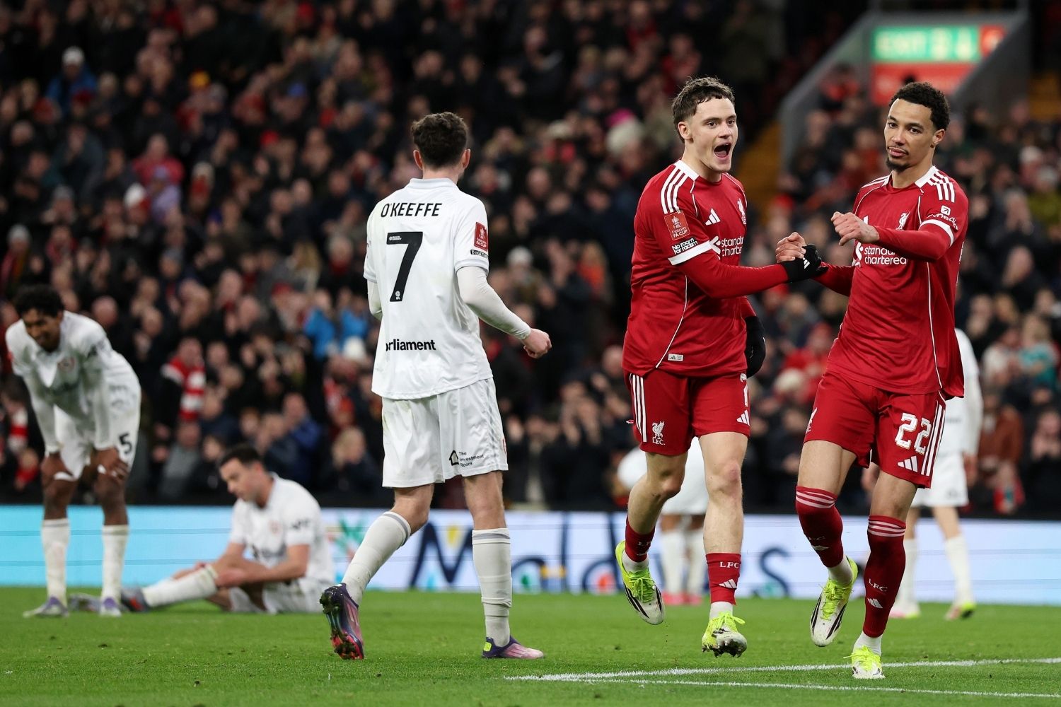 Florian Wirtz of Liverpool celebrates with teammate Hugo Ekitike after scoring his team's third goal during the Emirates FA Cup Third Round match between Liverpool and Barnsley