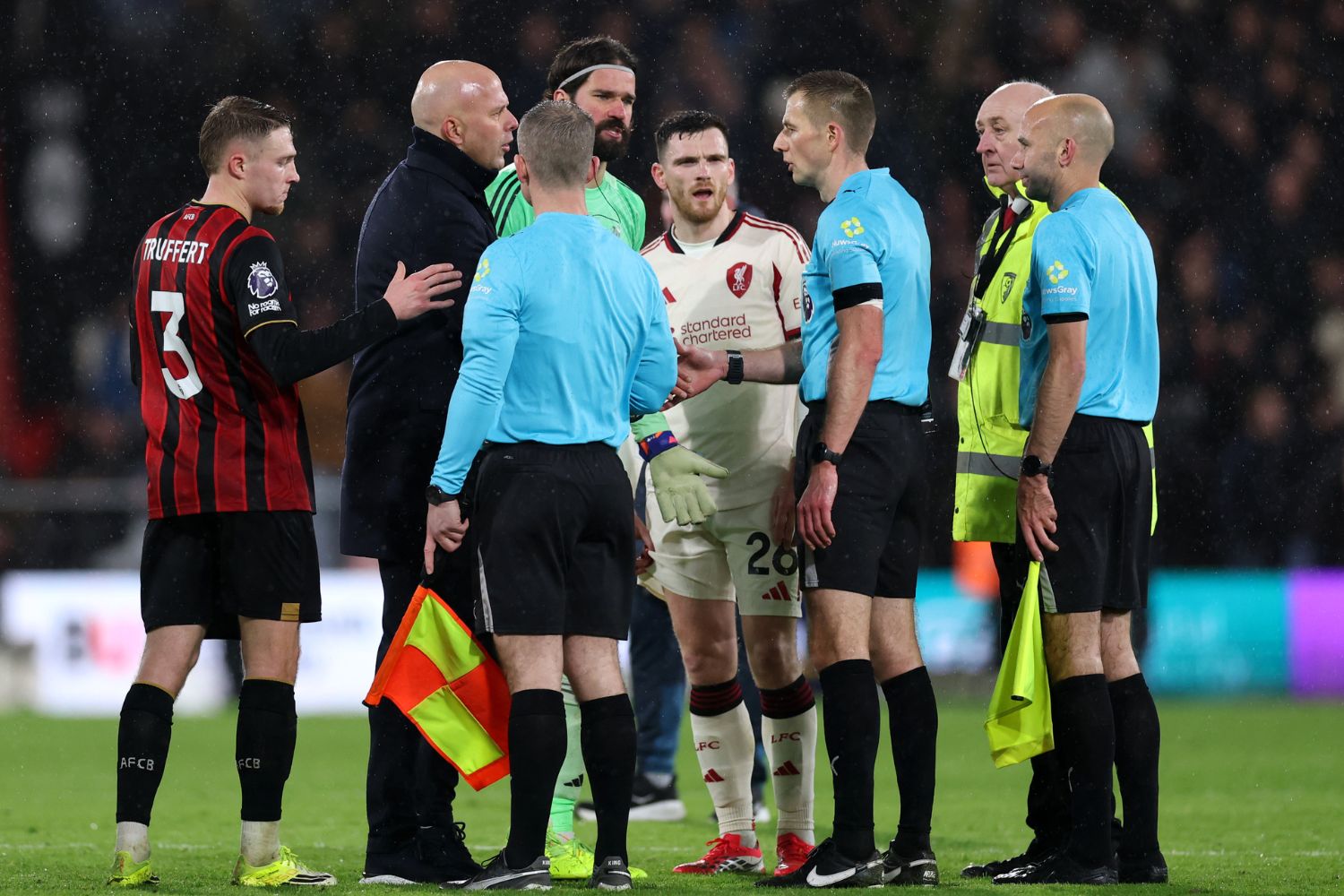 Arne Slot, Manager of Liverpool, shakes referee Michael Salisbury hand after the Premier League match between Bournemouth and Liverpool
