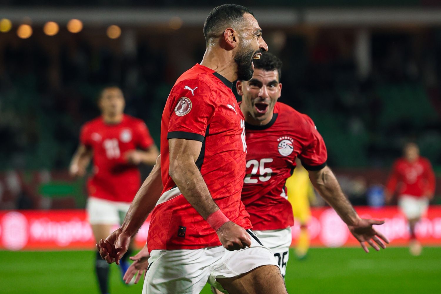 Mo Salah celebrates scoring against Benin