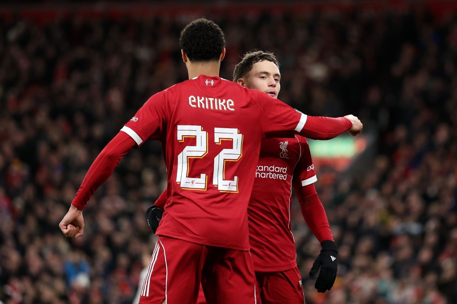 Florian Wirtz of Liverpool celebrates with teammate Hugo Ekitike after scoring his team's third goal during the Emirates FA Cup Third Round match between Liverpool and Barnsley