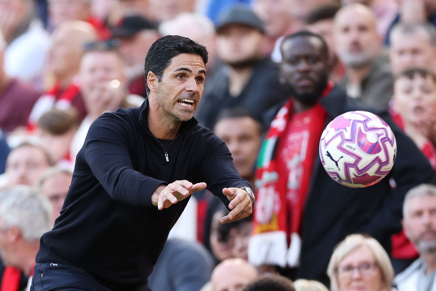 Mikel Arteta coaches Arsenal at Anfield