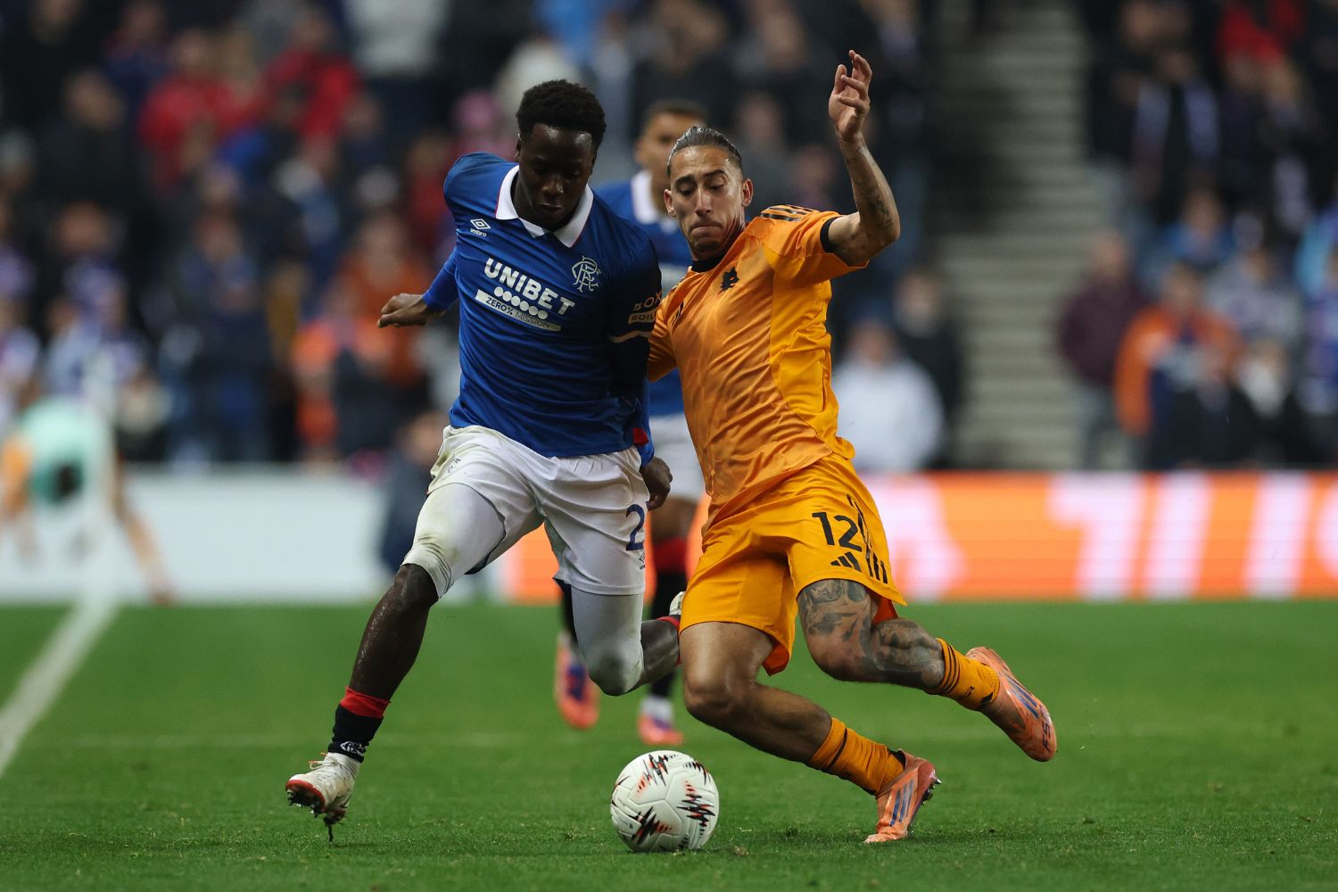 Nasser Djiga of Rangers is challenged by Kostas Tsimikas