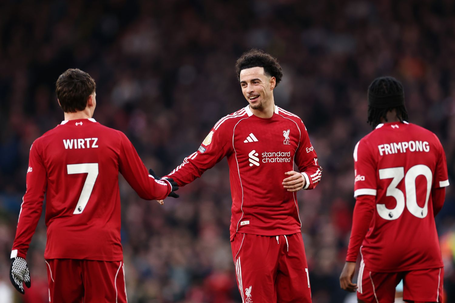 Curtis Jones celebrates with Florian Wirtz against Burnley