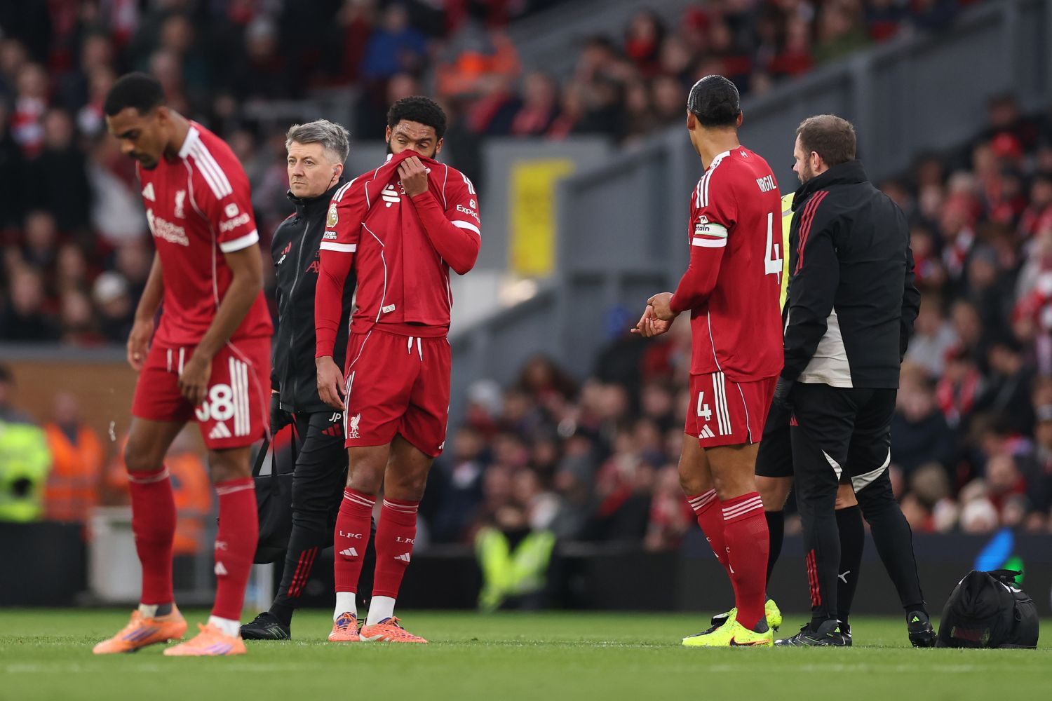 Joe Gomez of Liverpool receives medical treatment