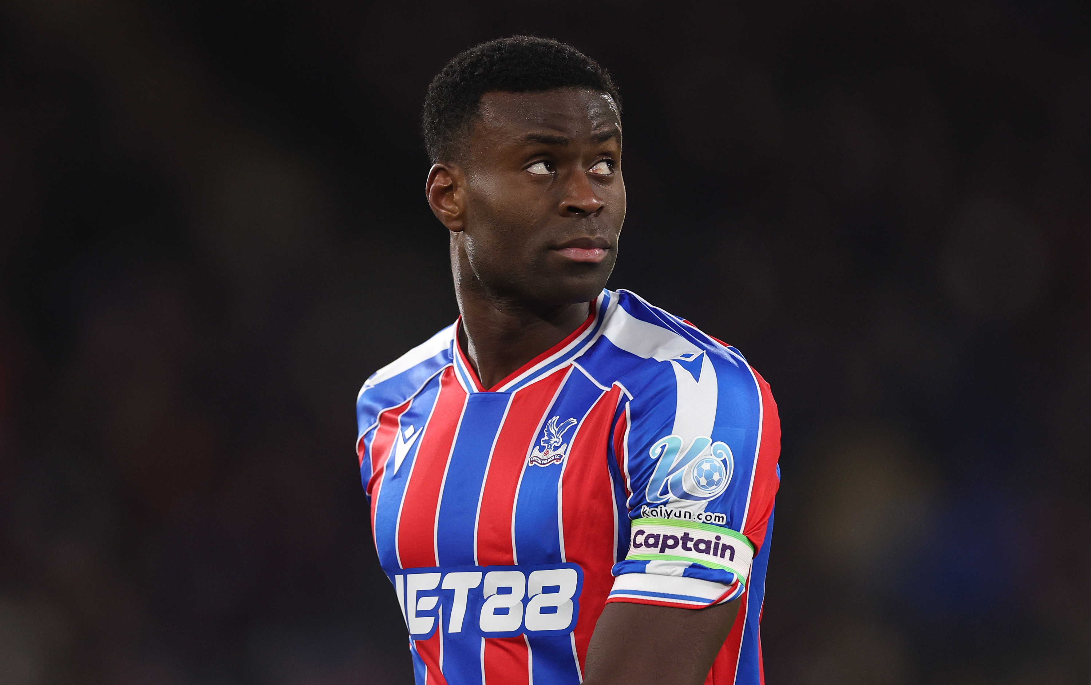 Marc Guehi looks over his right shoulder during Crystal Palace game.