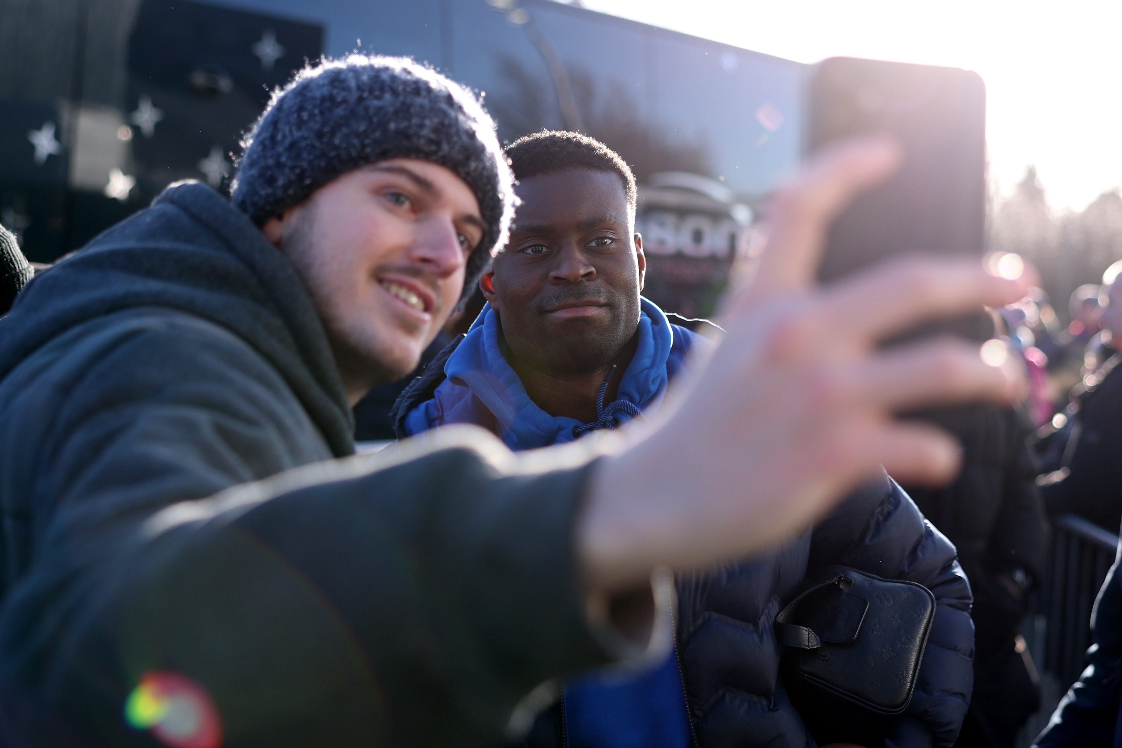 Marc Guehi takes a picture with a fan.