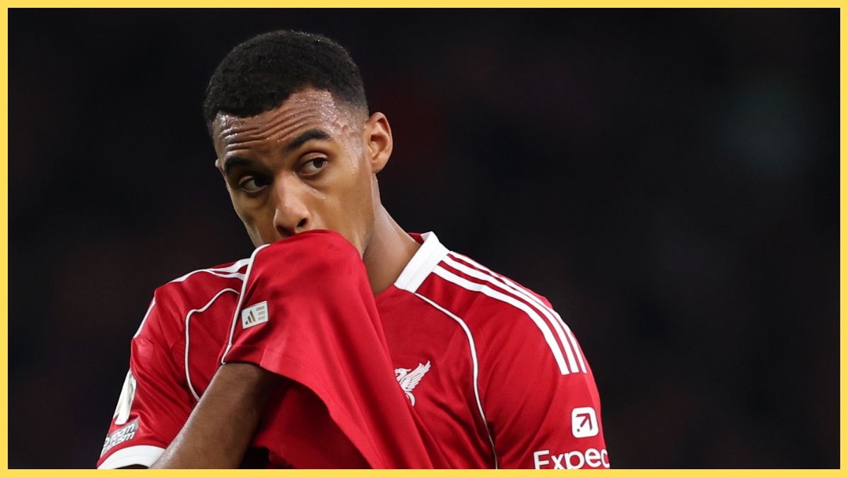 Ryan Gravenberch wipes his face with his Liverpool shirt.