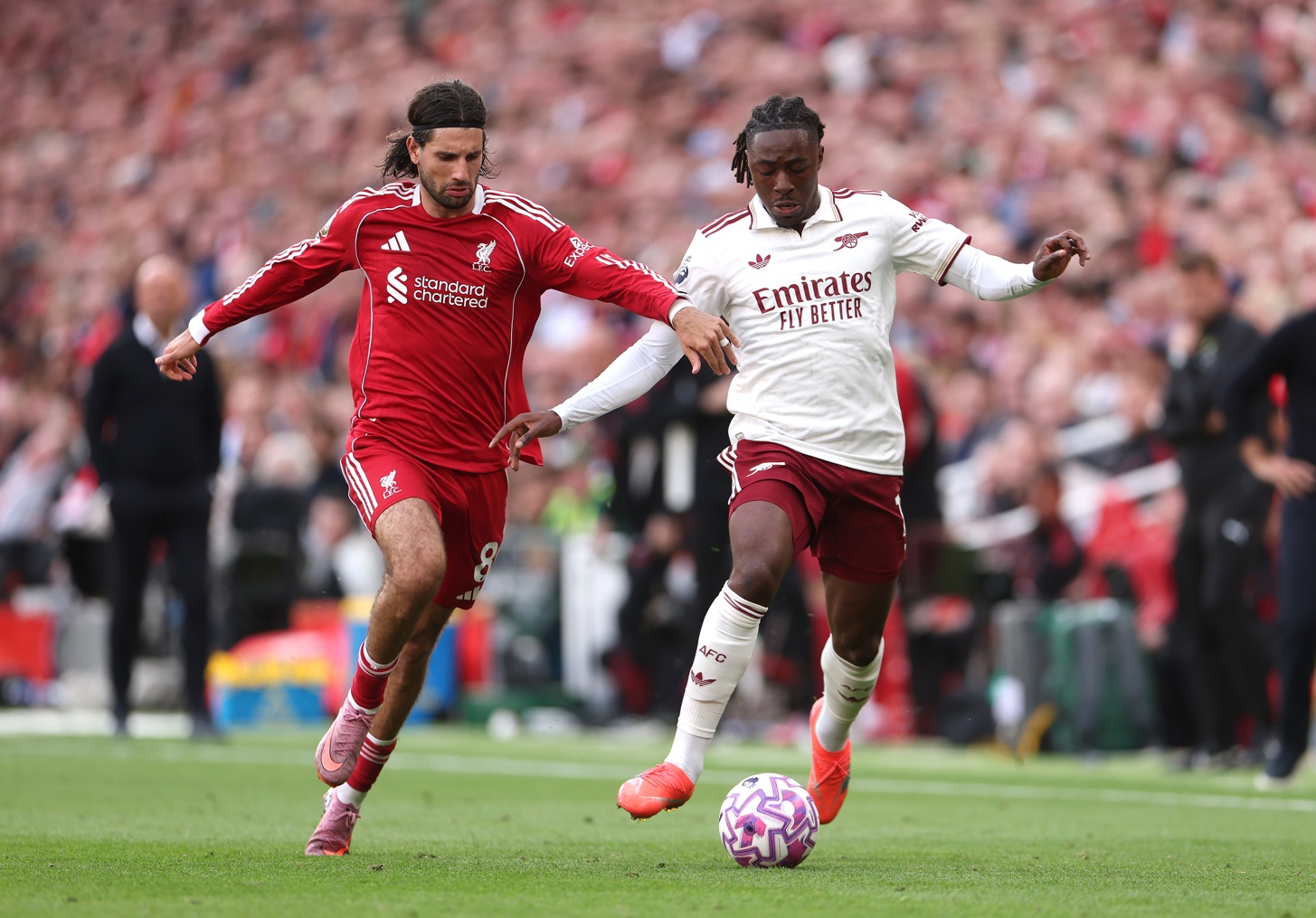 Emmanuel Eboue has claimed that Liverpool could still rival Arsenal in the Premier League title race