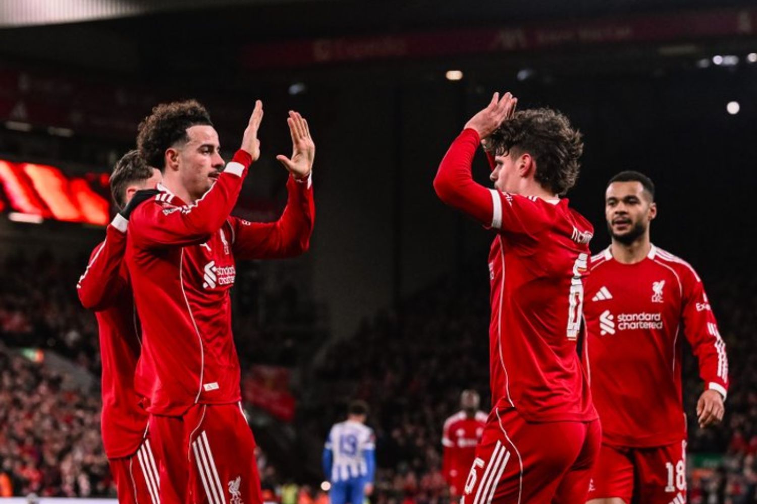 Curtis Jones and Milos Kerkez celebrate after scoring against Brighton