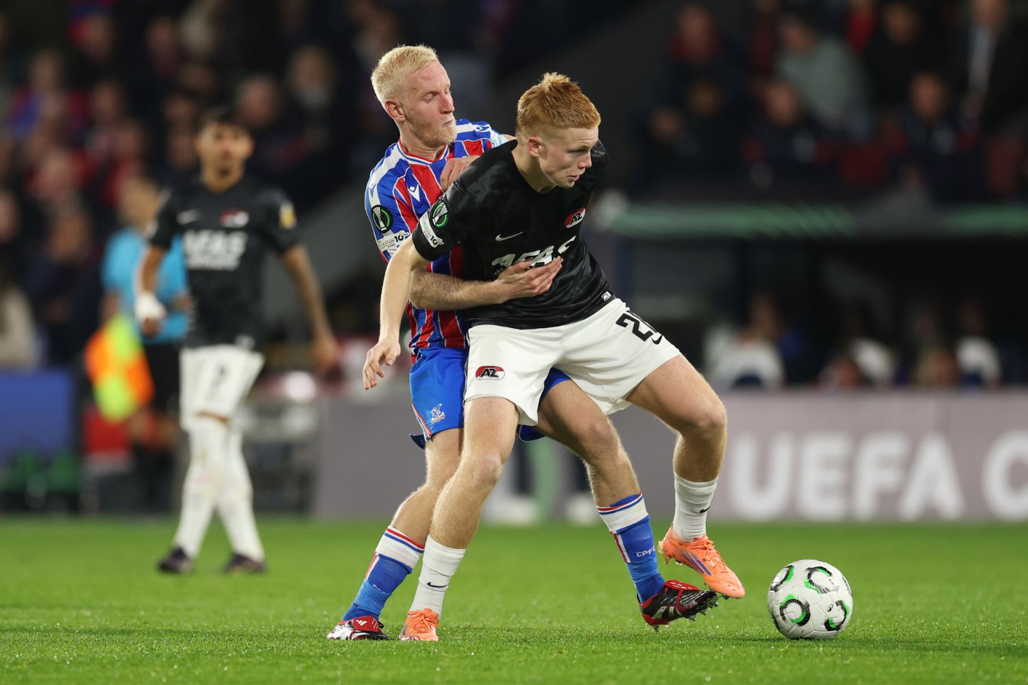 Kees Smit of AZ Alkmaar is challenged by Will Hughes of Crystal Palace during the UEFA Conference League