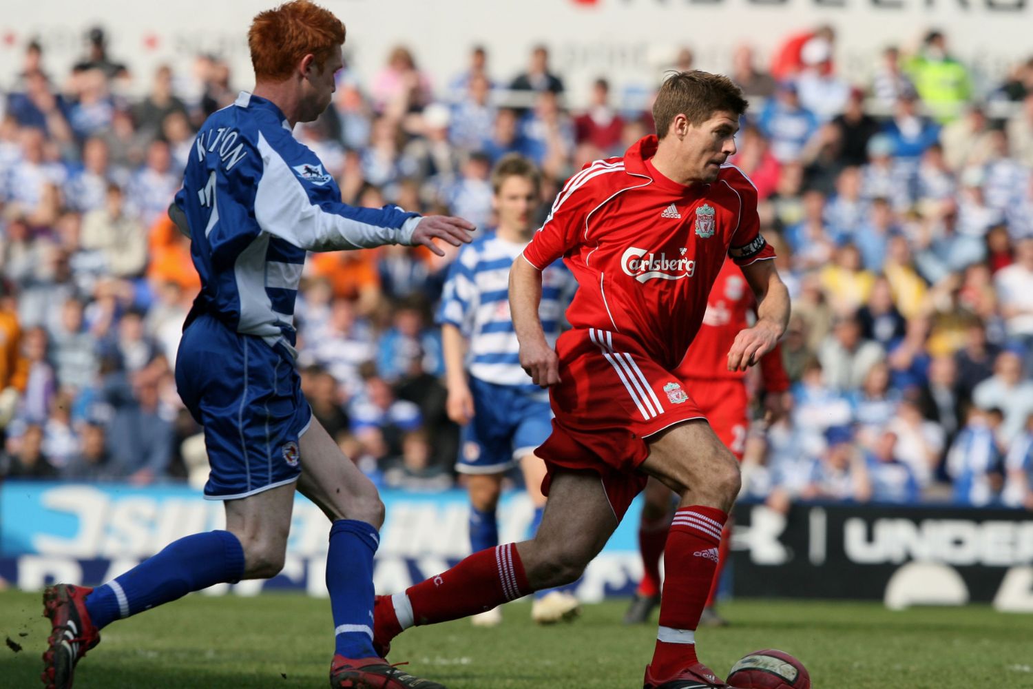 Steven Gerrard of Liverpool in action with Dave Kitson of Reading, in 2007
