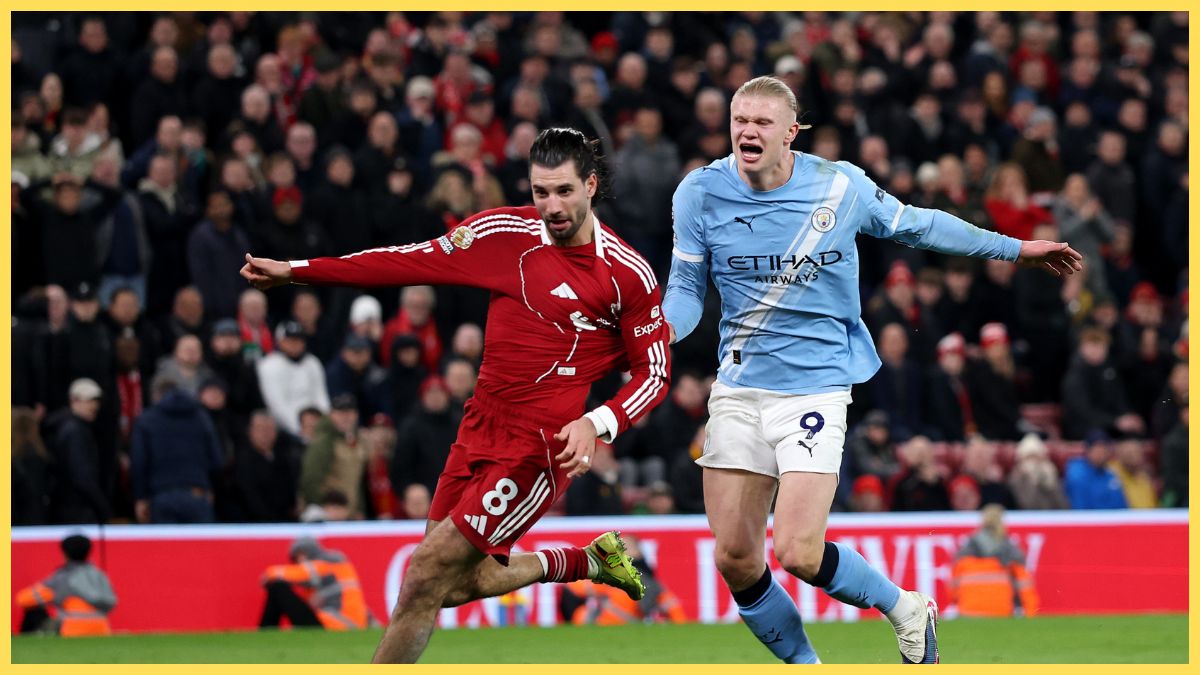 Erling Haaland of Manchester City fouls Dominik Szoboszlai