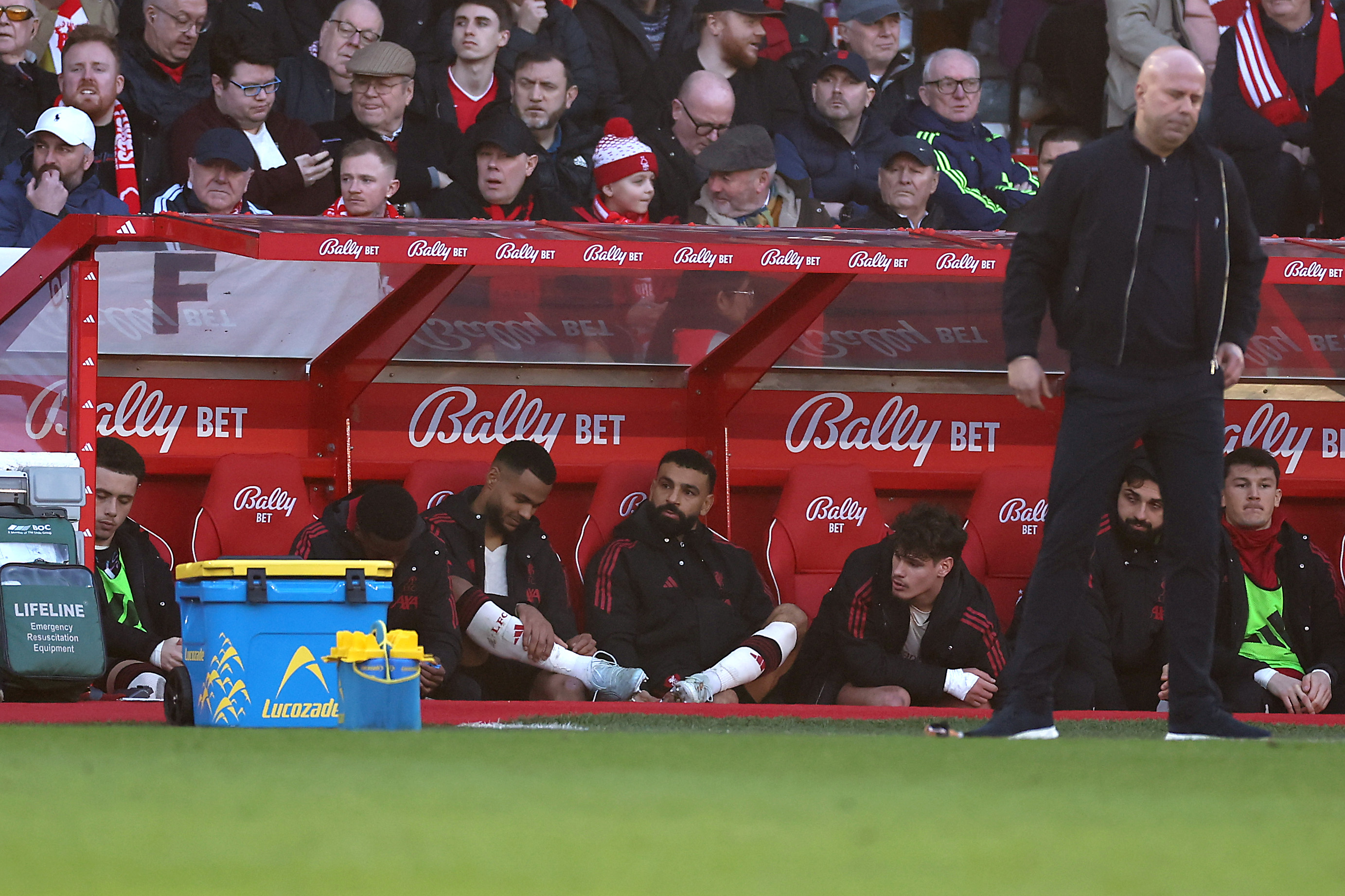 Mo Salah watches on from the subs' bench after being taken off in Liverpool's win at Nottingham Forest