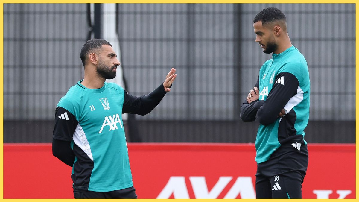 Mohamed Salah and Cody Gakpo of Liverpool FC talk during a training session at AXA Melwood Training Centre