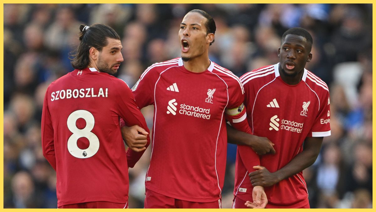 Virgil van Dijk of Liverpool lines up a wall with Dominik Szoboszlai and Ibrahima Konate during the Premier League match between Brighton & Hove Albion and Liverpool