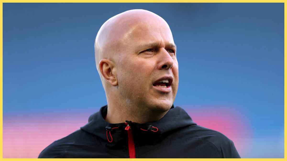 Arne Slot looks on at the Amex Stadium.