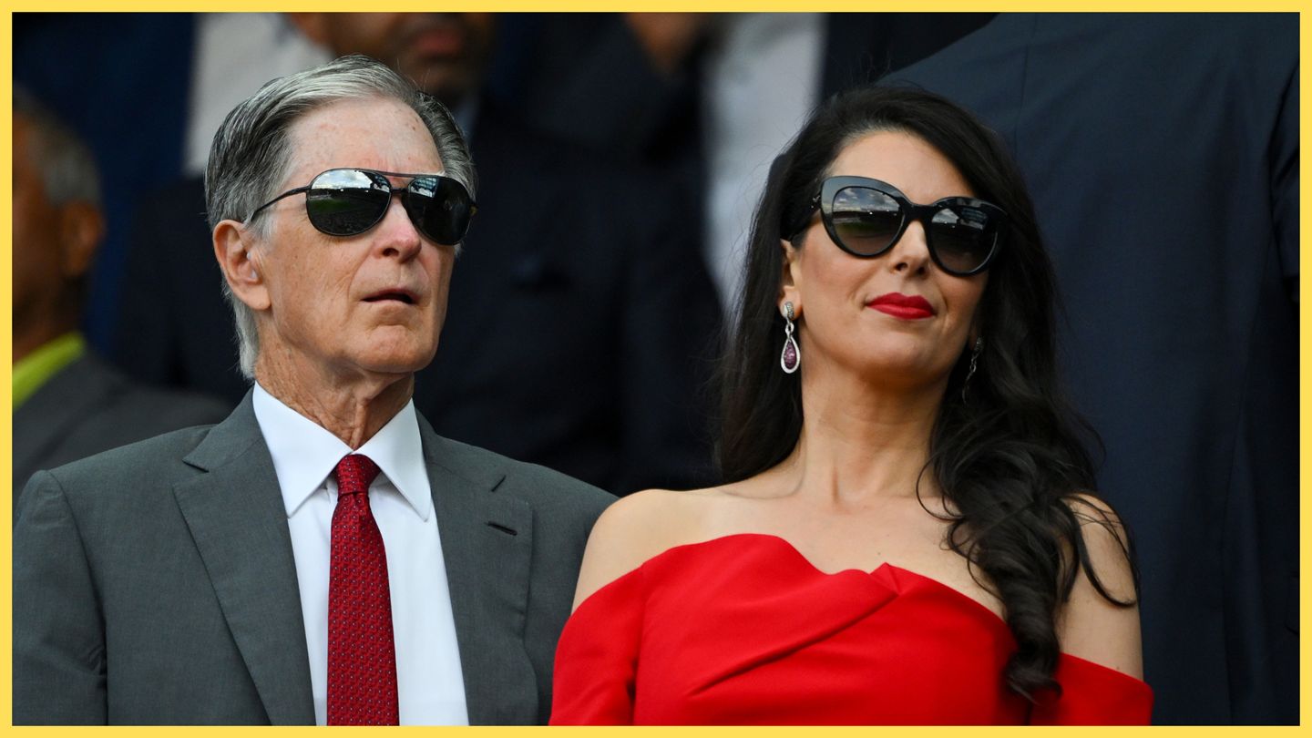 Liverpool's principal owner John W Henry stood next to his wife.