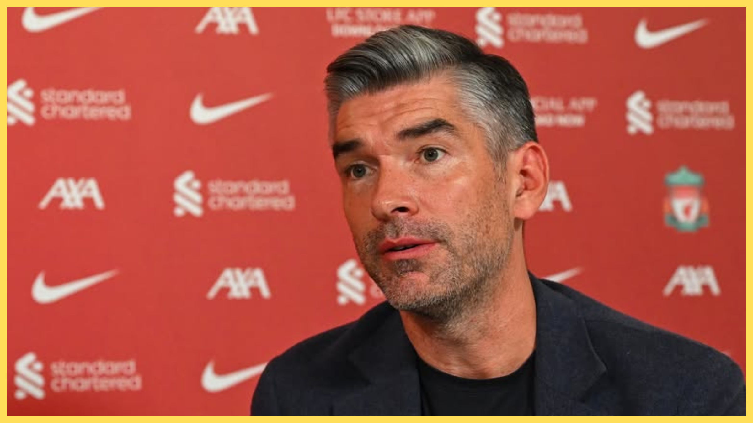 Richard Hughes listens during Liverpool press conference.