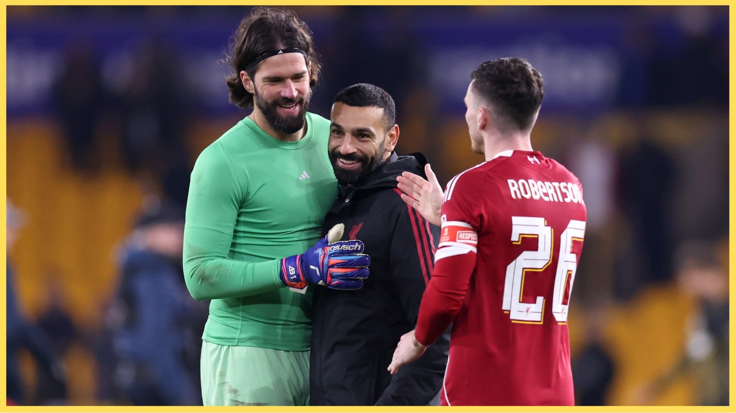 Alisson and Andy Robertson celebrate with Mo Salah after Liverpool's win over Wolves