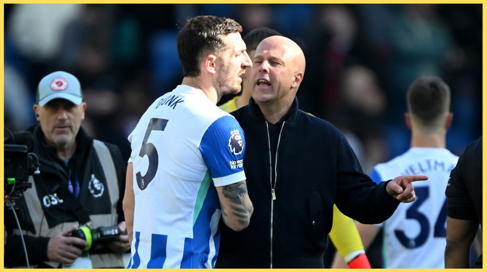 Arne Slot speaks to Lewis Dunk after Liverpool's defeat at Brighton