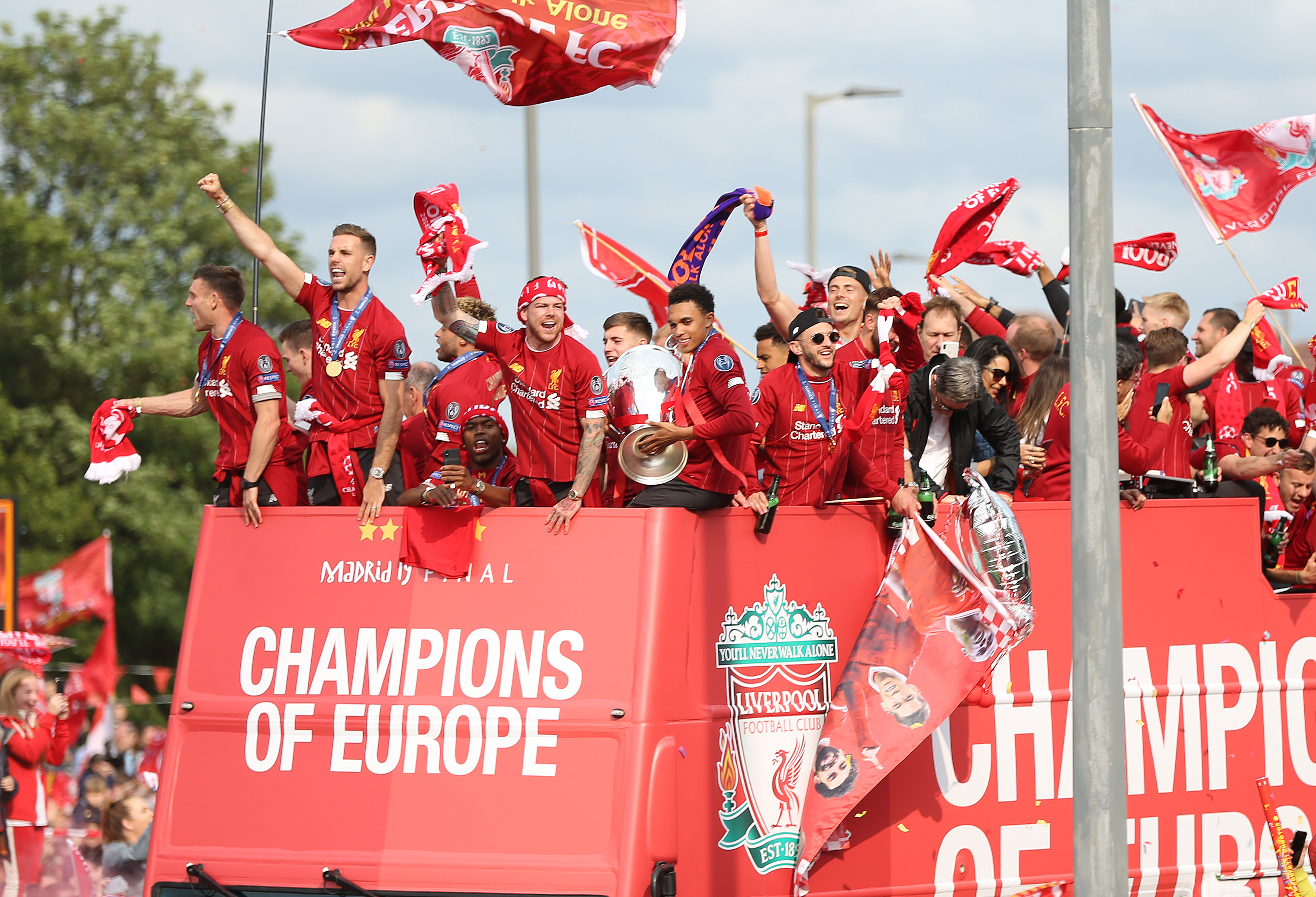 Liverpool players parade the Champions League trophy around the city after winning the tournament in 2019