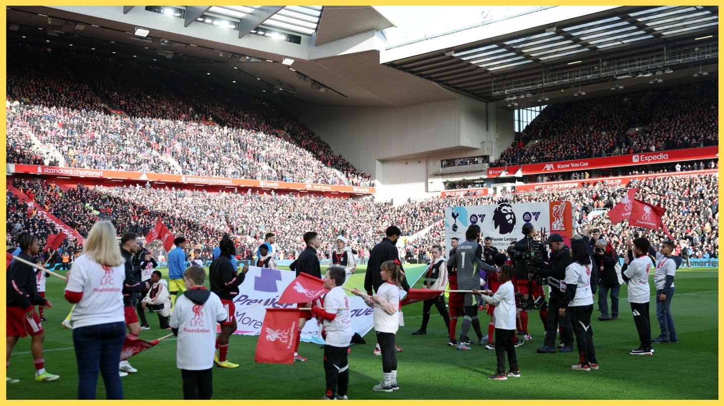 Liverpool players take to the pitch before a game at Anfield