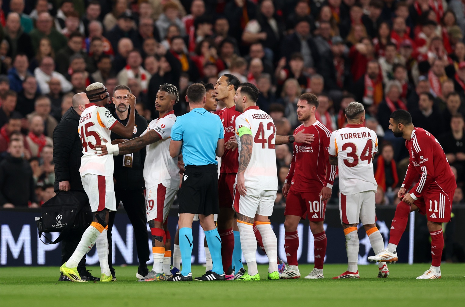 Victor Osimhen and Virgil van Dijk exchange strong words during Liverpool's win over Galatasaray