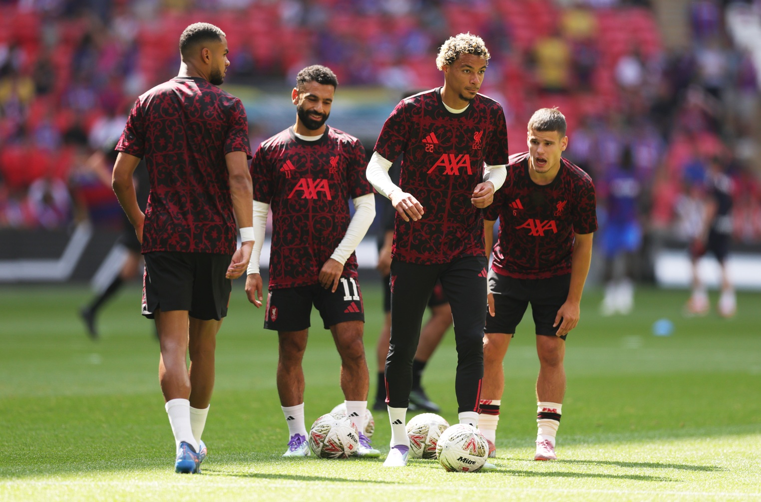 Mo Salah and Hugo Ekitike partake in warm-up drills prior to the Community Shield