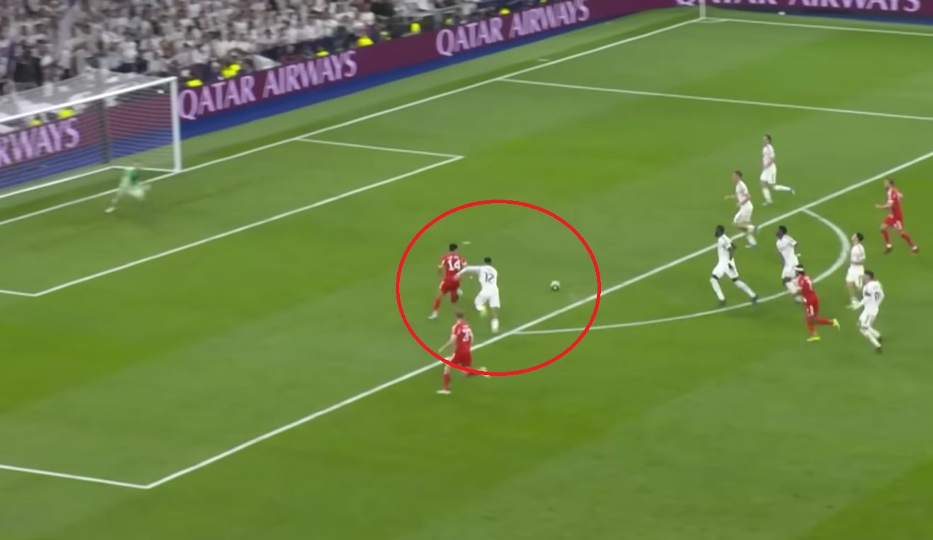 Trent Alexander-Arnold chases Luis Diaz inside the Real Madrid box.