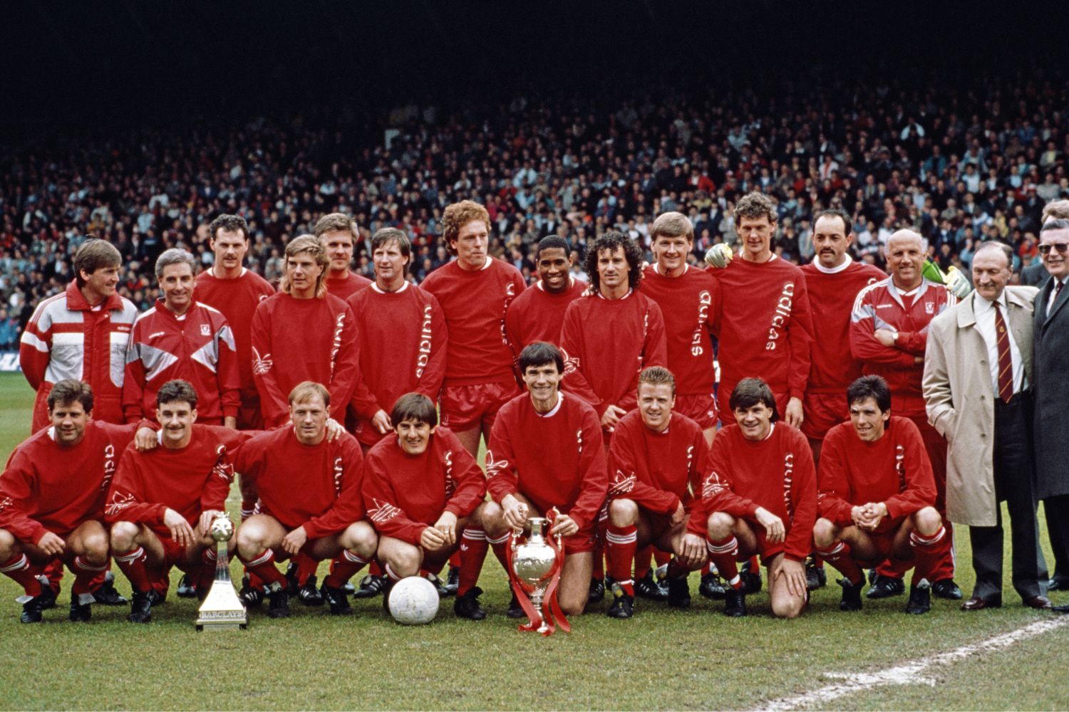The Liverpool team are pictured after being crowned League Champions before the Barclays League Division One match against Southampton at Anfield in Liverpool, England, United Kingdom, Back Row left to right, Player/Manager Kenny Dalglish, Roy Evans, Kevin MacDonald, Barry Venison, Jan Molby, Ronnie Whelan, Mike Hooper, John Barnes, Craig Johnston, Nigel Spackman, Gary Gilespie, Bruce Grobbelaar, Ronnie Moran, Front Row, Jim Beglin, John Aldridge, Steve McMahon, Peter Beardsley, Alan Hansen with trophy, Steve Nicol, Ray Houghton and Gary Ablett.