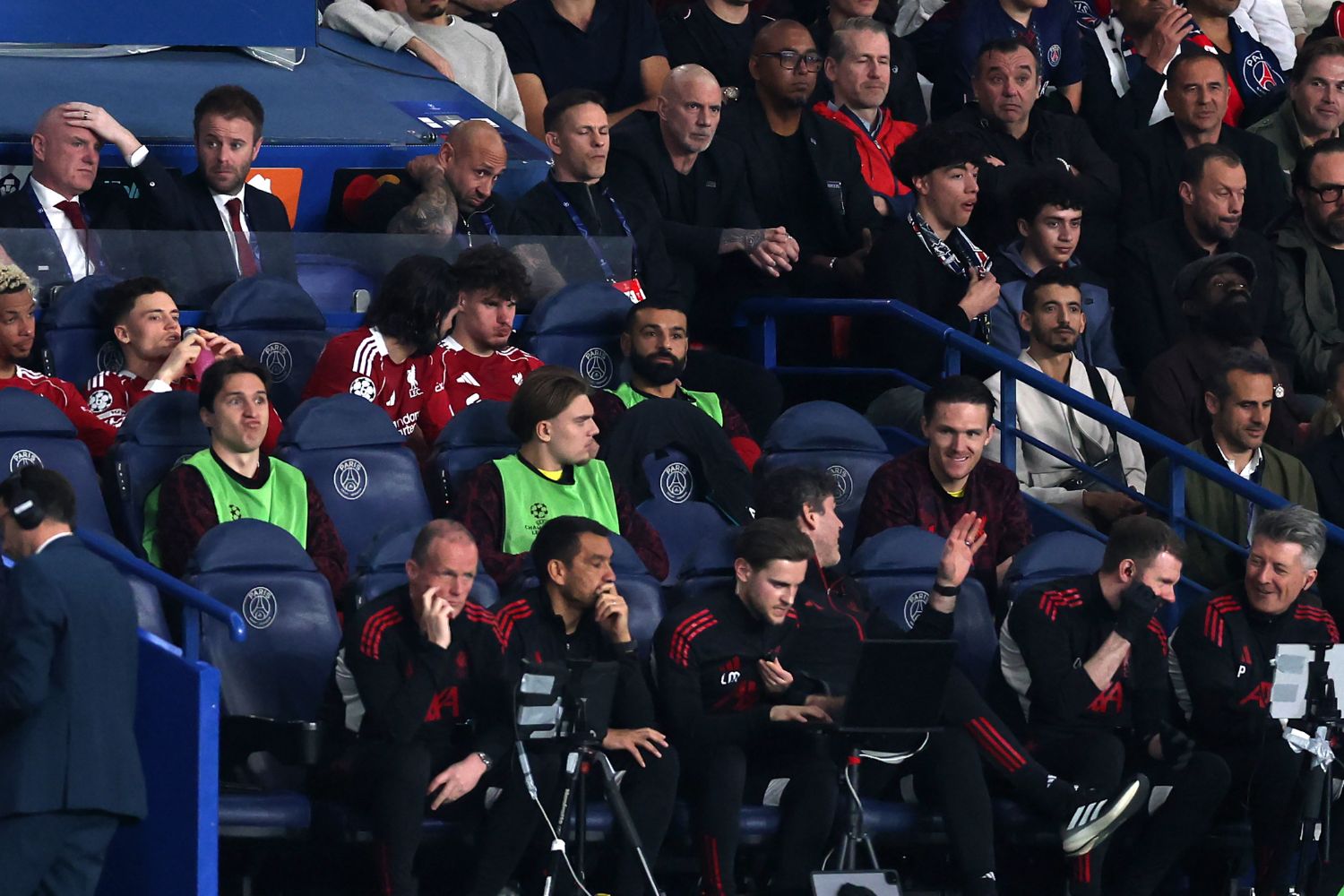 Mo Salah of Liverpool sits on the bench during the UEFA Champions League 2025/26 Quarter-Final First Leg match between Paris Saint-Germain FC and Liverpool FC at Parc des Princes. Tony Barrett also pictured
