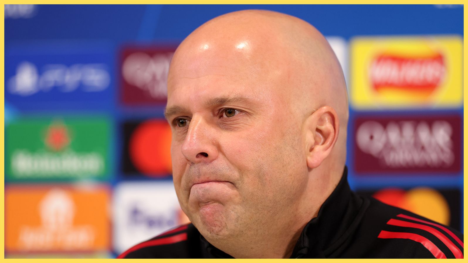 Arne Slot looks on tight-lipped during Liverpool presser.