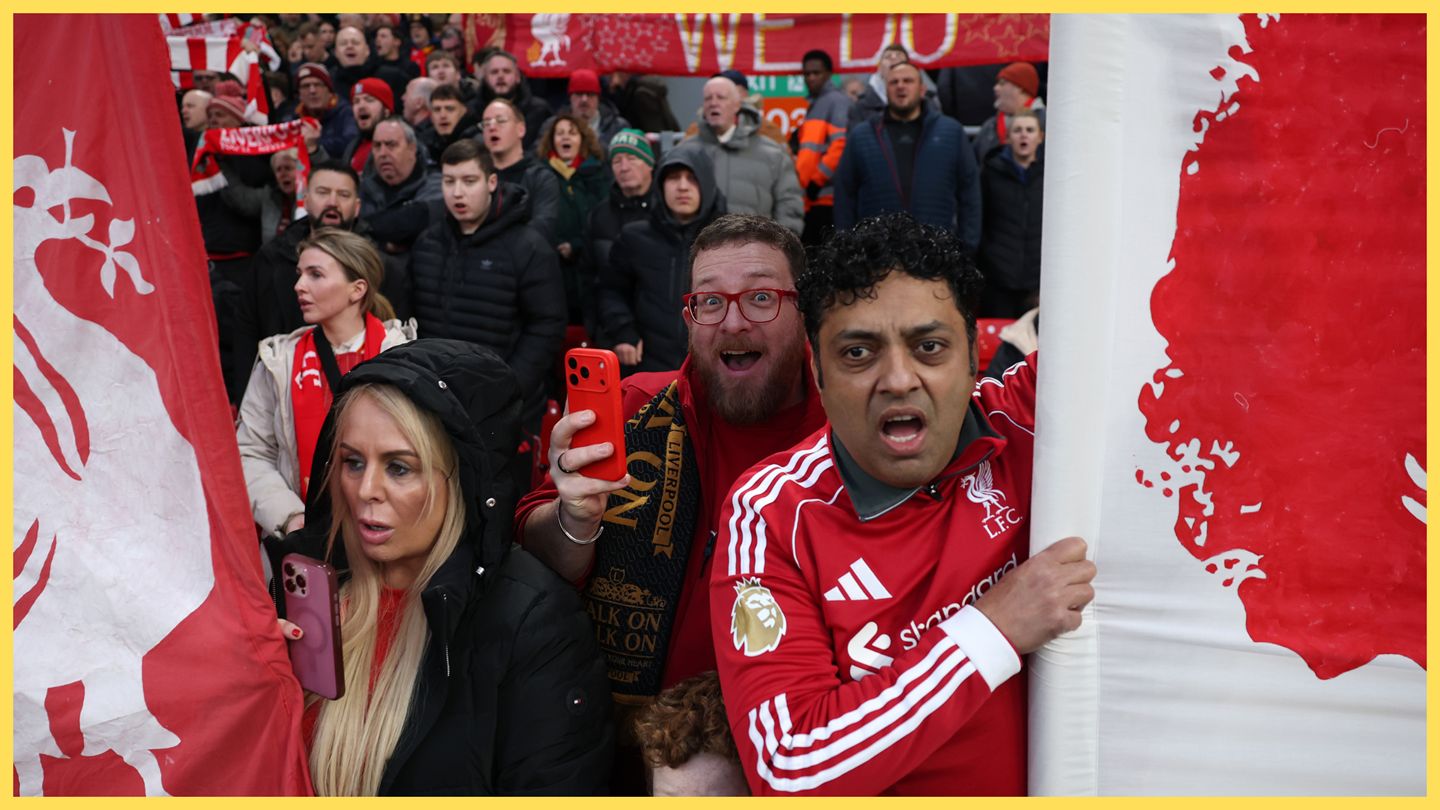 Liverpool fans look on open-mouthed from the stands.